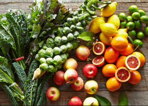 a group of fruits and vegetables on a wood surface Healthy Weight Loss Diets Cambridgeshire