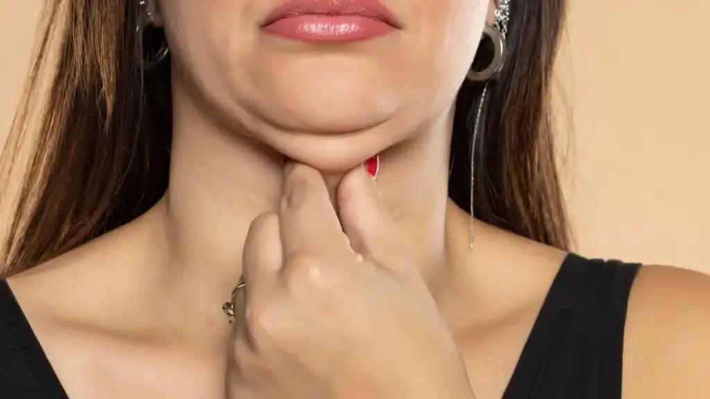 An image of a woman with double chin, sad, worried : Non Surgical Double Chin Removal Treatment in Cambridgeshire, UK